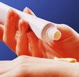 A Lanolin Based Lanicare™  Skin Product Being Applied to Back of Hand Out of Tube