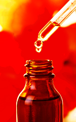 Drop of Ultra Pure Oil Being Added to a Medical (USP) Lanolin Skin Care Formulation
