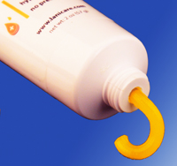 Close Up View of a Medical (USP) Lanolin Skin Care Salve Being Squeezed From a Medical Tube